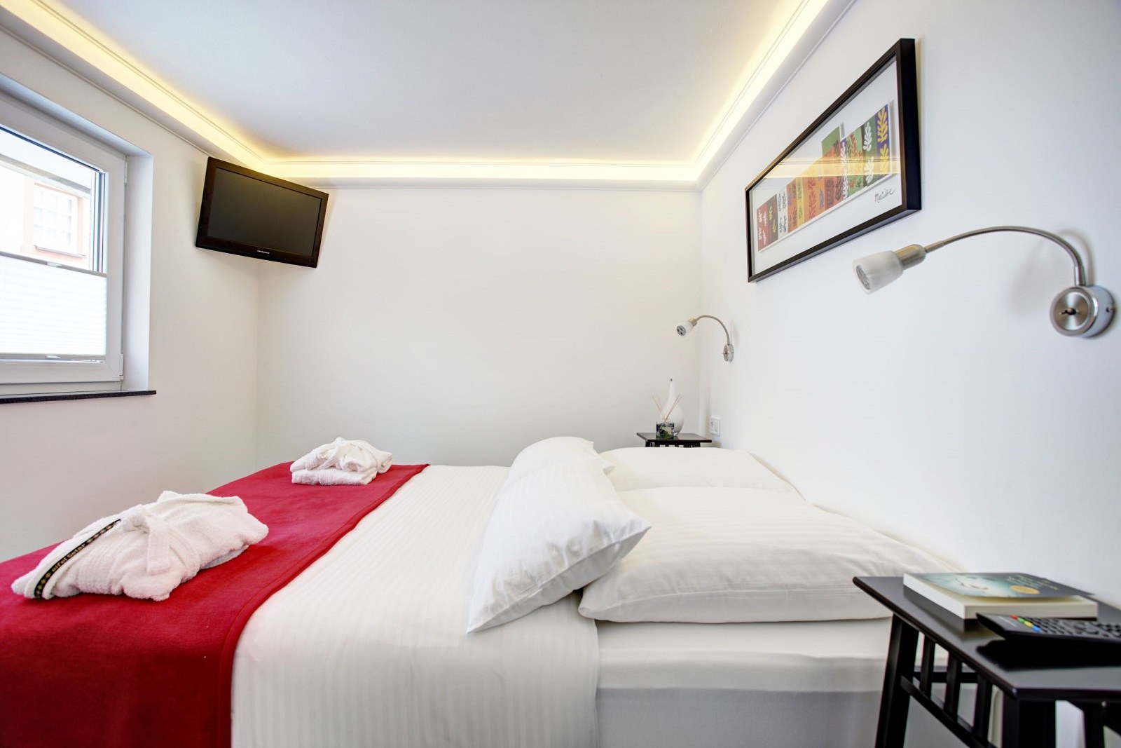 Schlafbereich mit Doppelbett der Ferienwohnung 1
