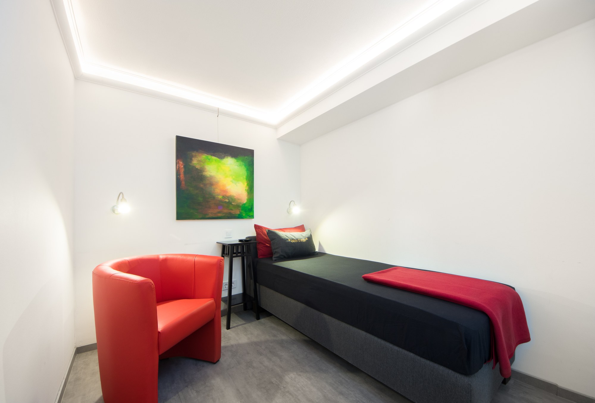 Schlafbereich mit Einzelbett der Ferienwohnung 1